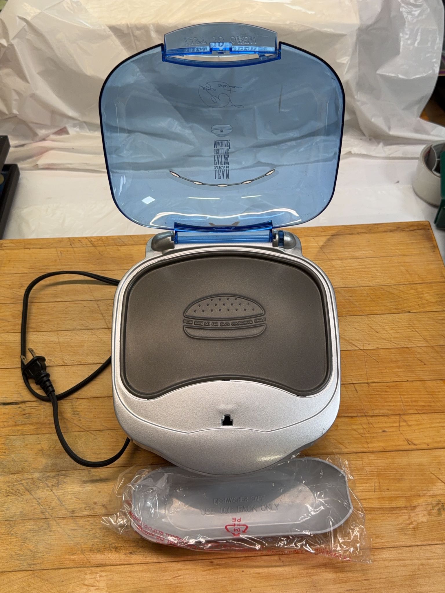 George Foreman GR10ABW electric grill with drip tray, assorted pots and pans, two bags BBQ wood ...