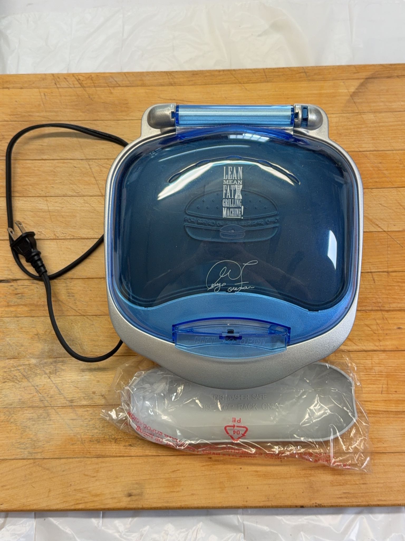 George Foreman GR10ABW electric grill with drip tray, assorted pots and pans, two bags BBQ wood ...