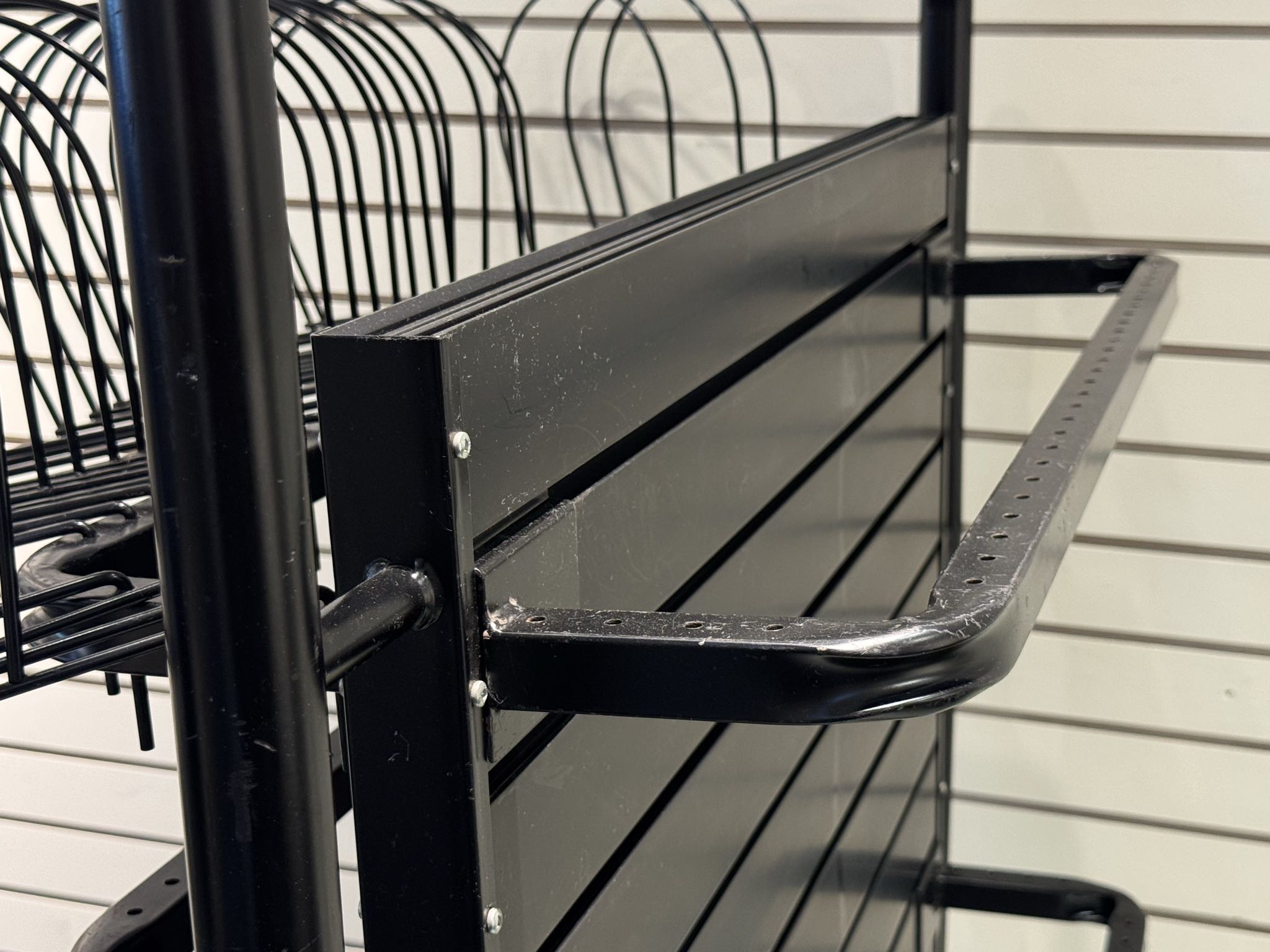 Black metal retail display rack with bars | Maxsold