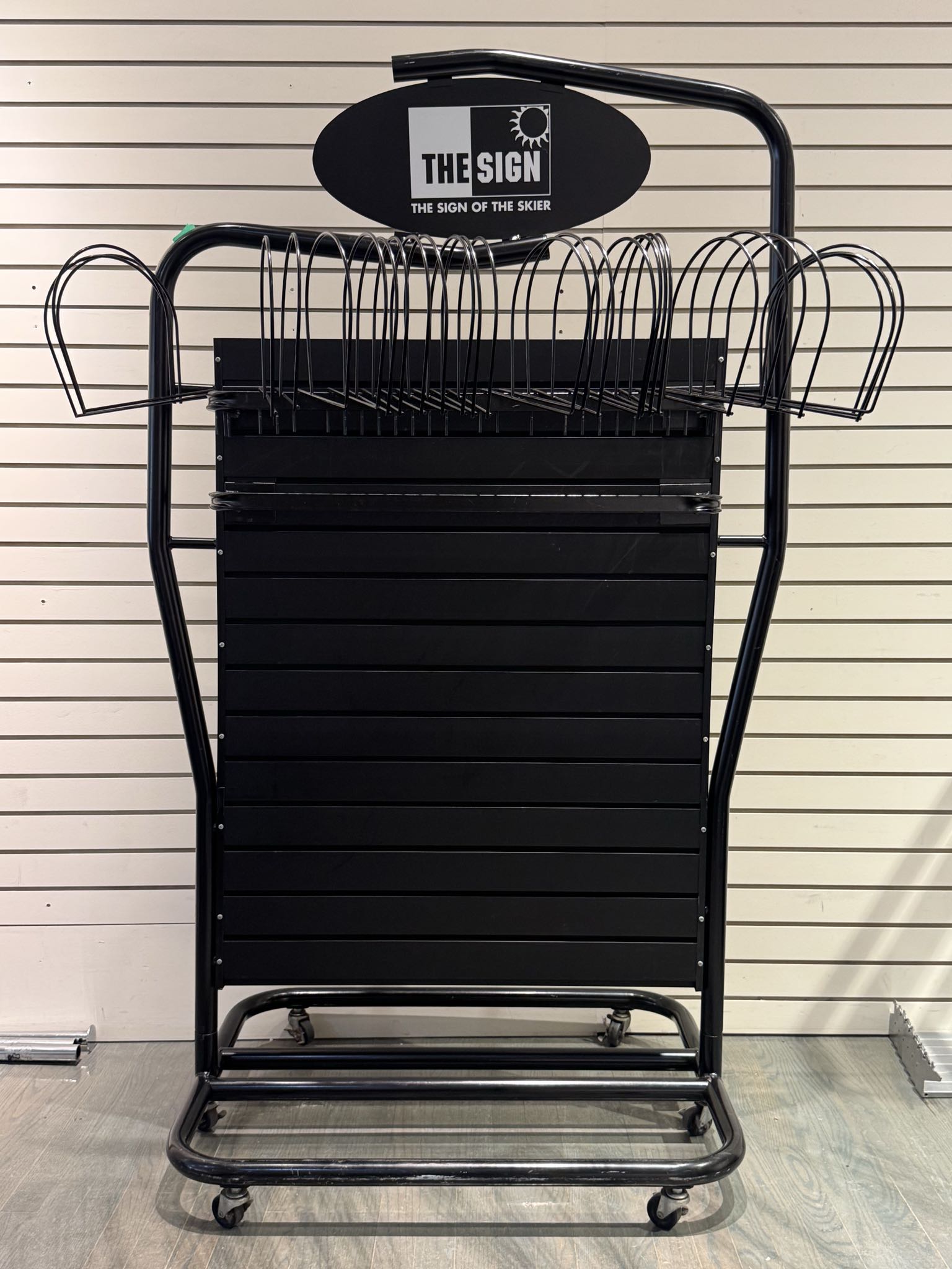 Black metal retail display rack with bars | Maxsold