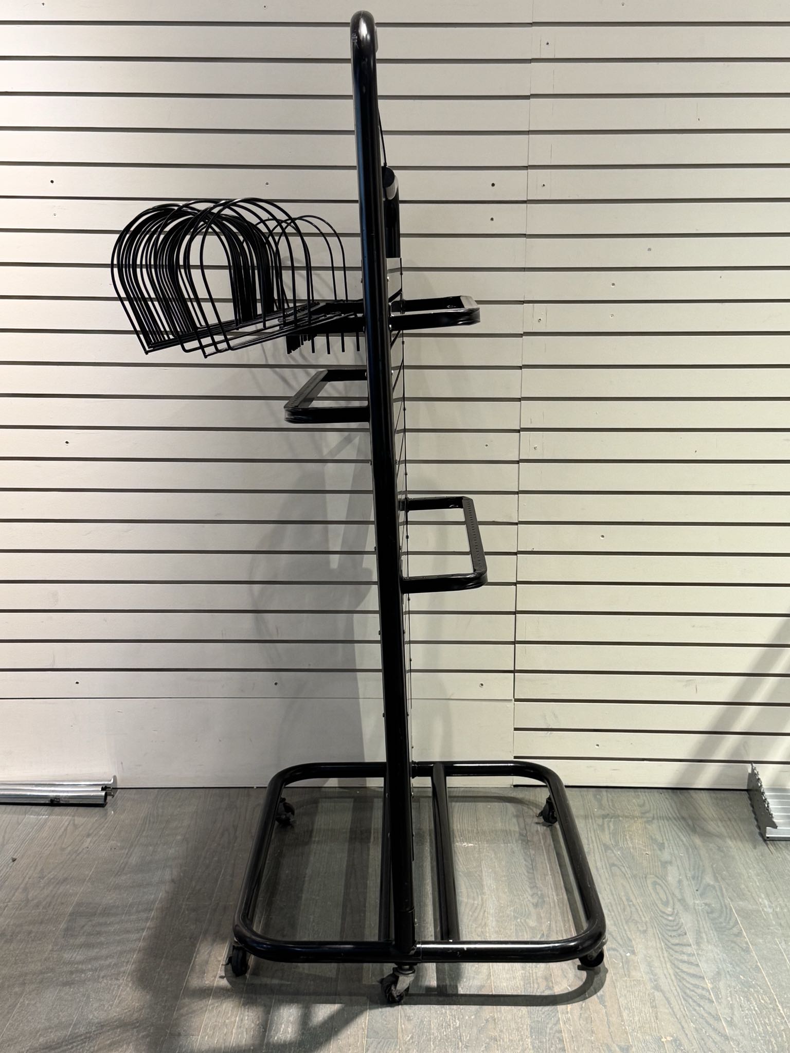 Black metal retail display rack with bars | Maxsold