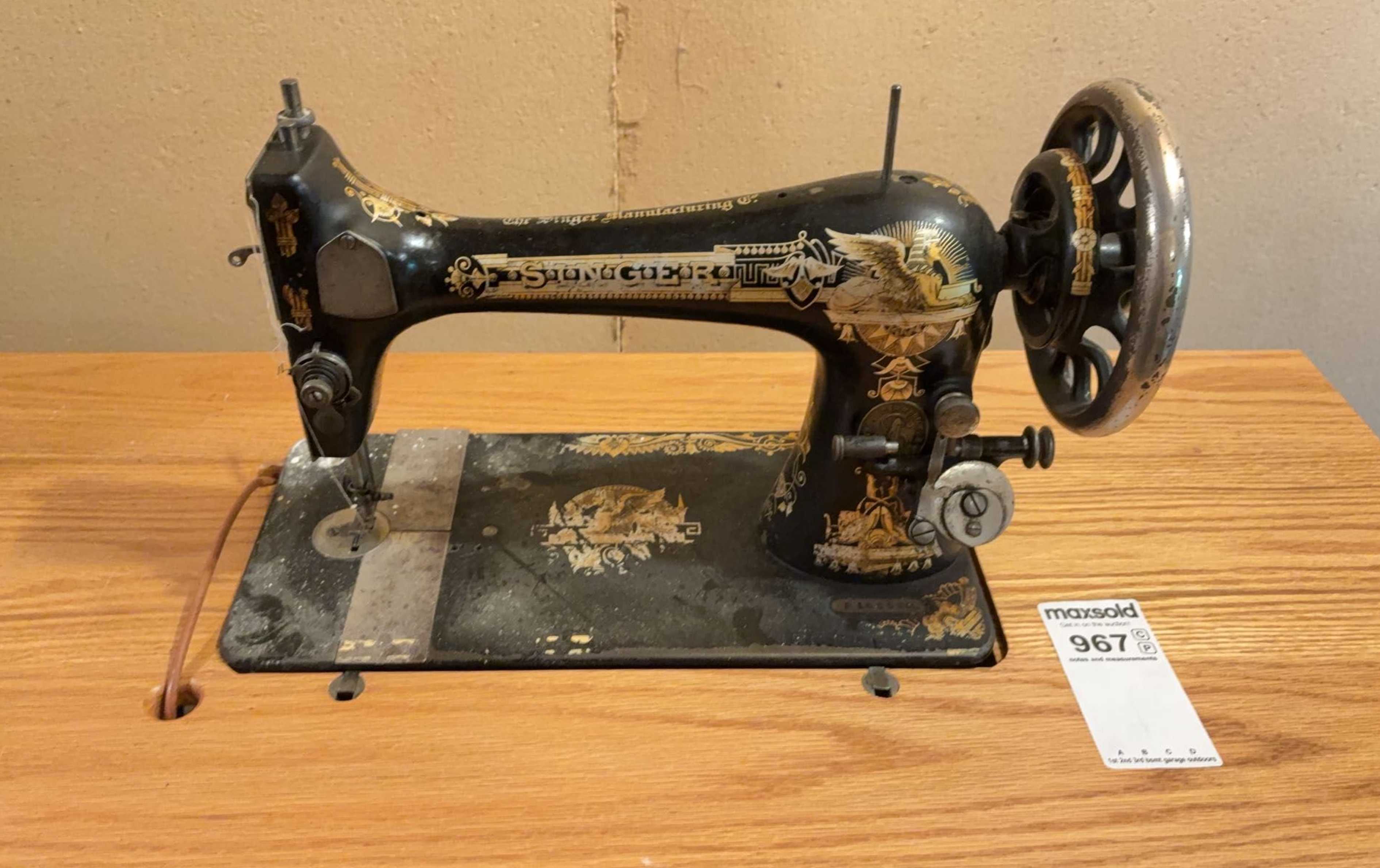 Singer treadle sewing machine on cast iron base | Maxsold