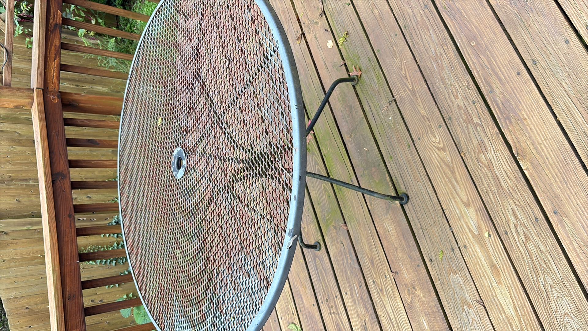 Wrought iron patio table with four chairs | Maxsold