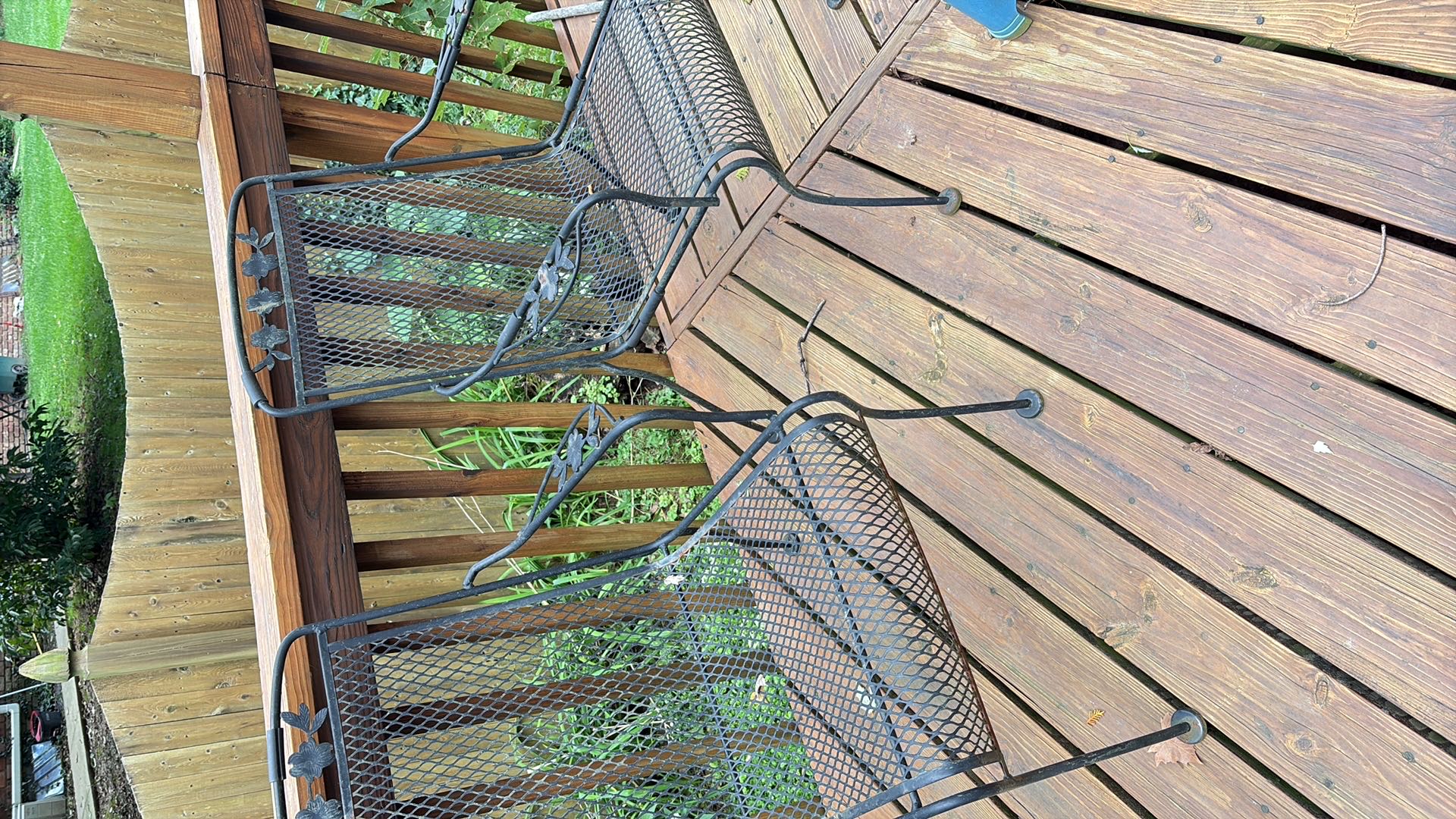 Wrought iron patio table with four chairs | Maxsold