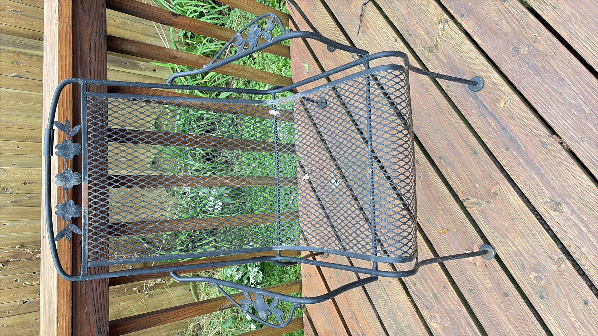 Wrought iron patio table with four chairs | Maxsold