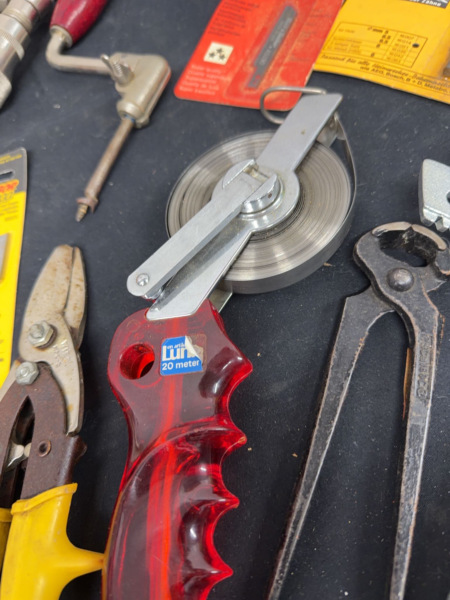 Hand tools assortment with brace drills, snips, hole saws, bits ...