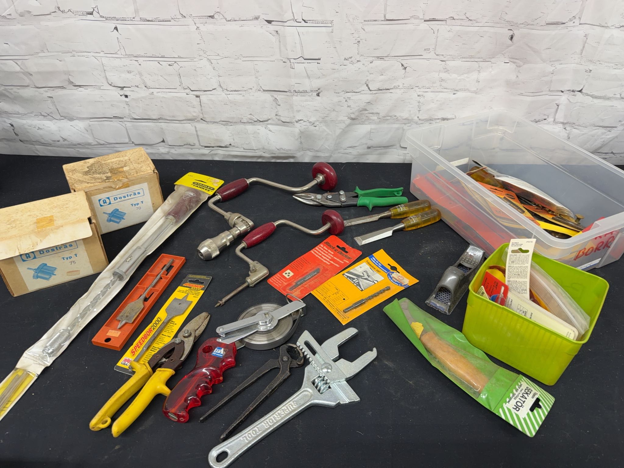 Hand tools assortment with brace drills, snips, hole saws, bits ...