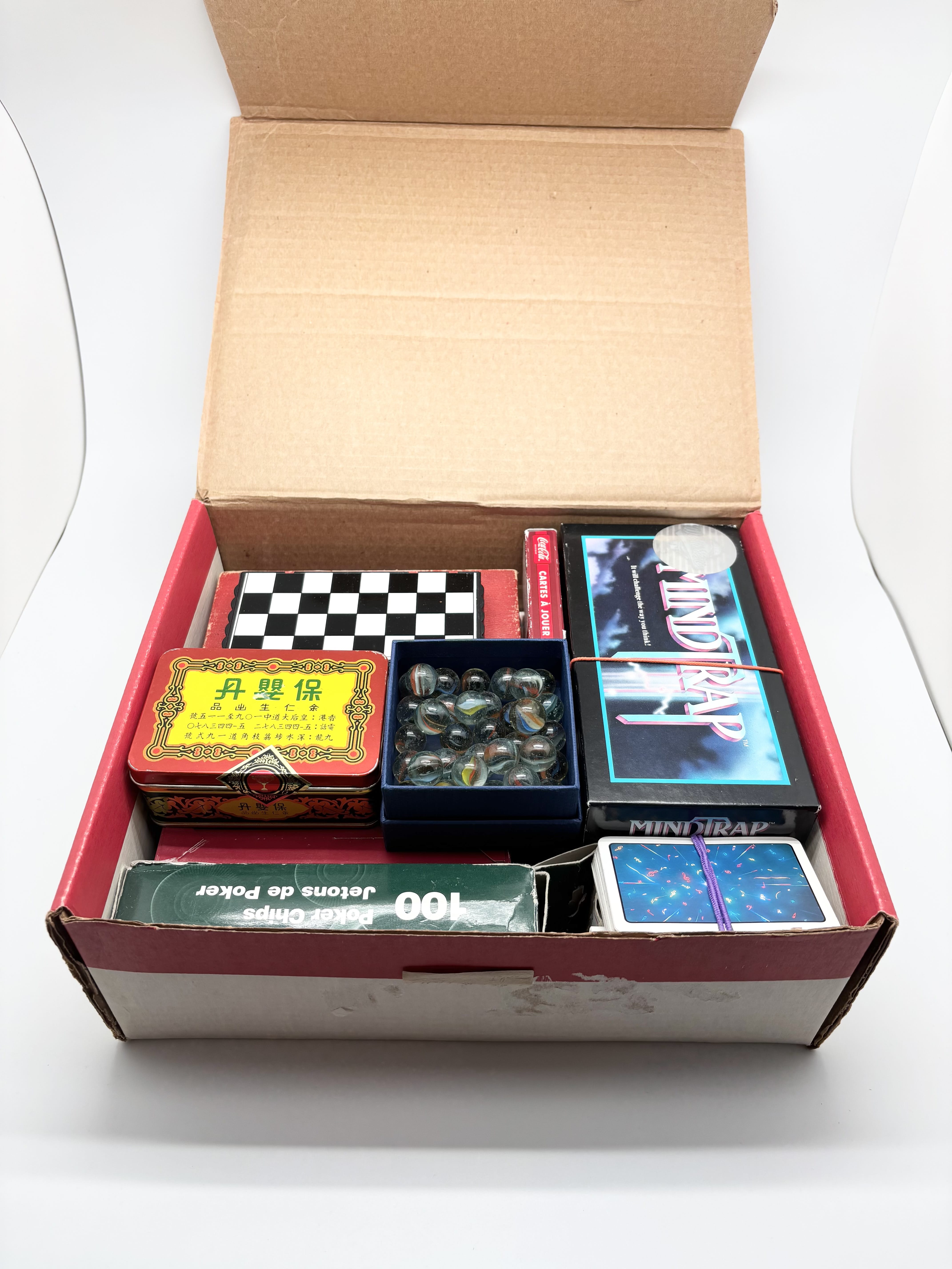 Mixed playing cards, poker chips, marbles and travel checker set | Maxsold