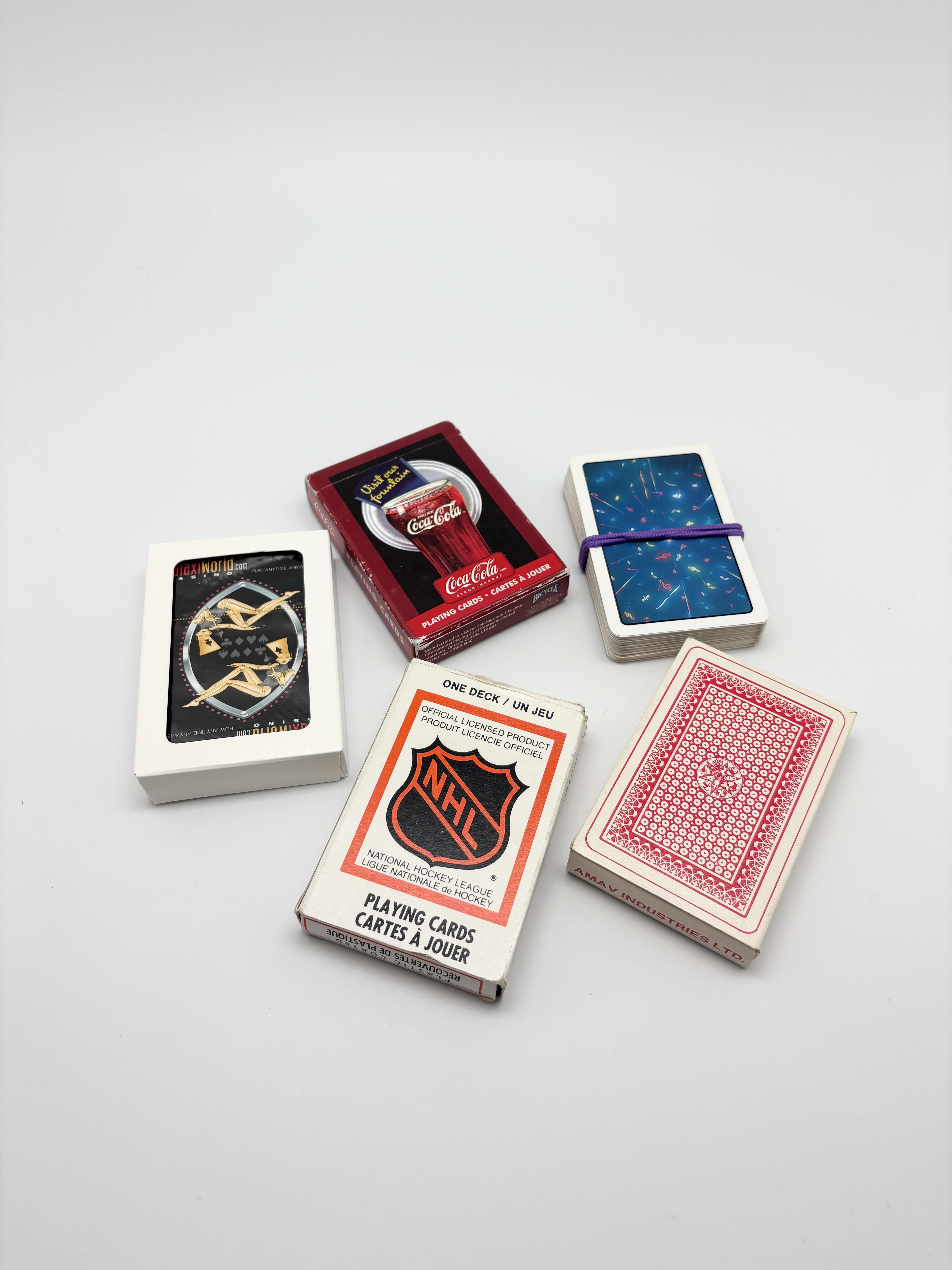 Mixed playing cards, poker chips, marbles and travel checker set | Maxsold